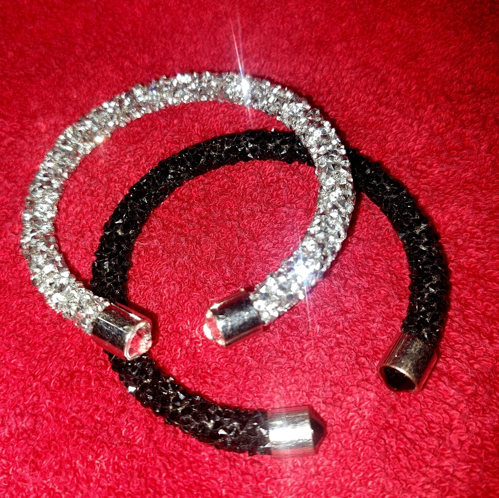 Set of 2 sparkly cuff bracelets with corresponding rhinestones on each end